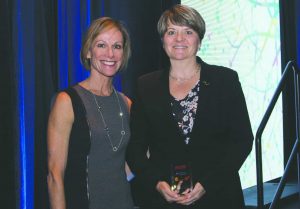 Boston Business Journal Publisher Carolyn Jones with honoree Lisa Brothers of Nitsch Engineering at the Boston Business Journal's Women of Influence awards breakfast.