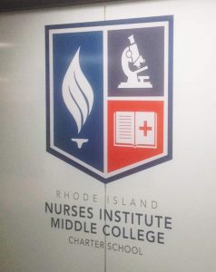 RI Nurses Institute Middle College installation of logo, opaque white 3M™ Scotchcal™ Electrocut Film and 3M™ Scotchshield™ Safety & Security Film on classroom glass wall panels.