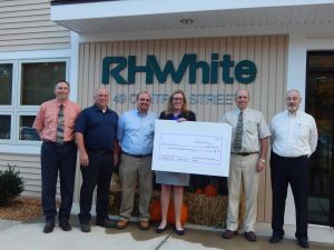 RH White team presenting charity check