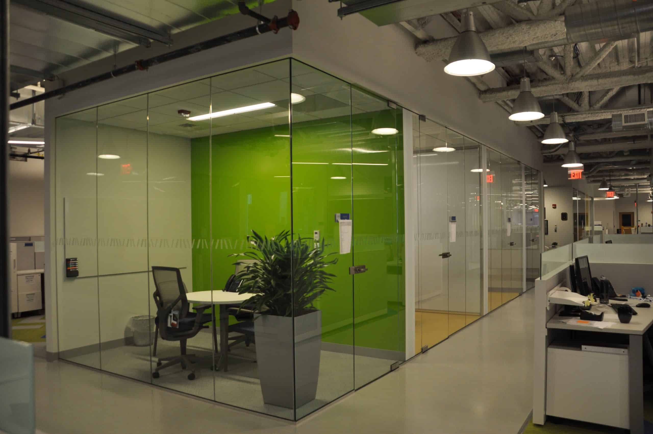 Bright accent colors, coordinated with the corporate colors of Bluebird Bio, visually punctuate the huddle rooms in the open office environment. Photo Credit: LAB / Life. Science. Architecture, Inc.