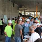 Members of the design/build team mingle with Lesley University staff at the topping off ceremony.
