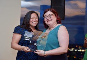SMPS Boston Chapter President Anna Luciano presents Margulies Perruzzi Architects’ Mktg Mgr Stephanie Tyll w/the 2016 SMPS Boston Award for 1st place in the holiday digital piece category/Frank Monkiewicz 