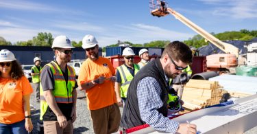 Western-Bryan Hughes Signs the Final Beam